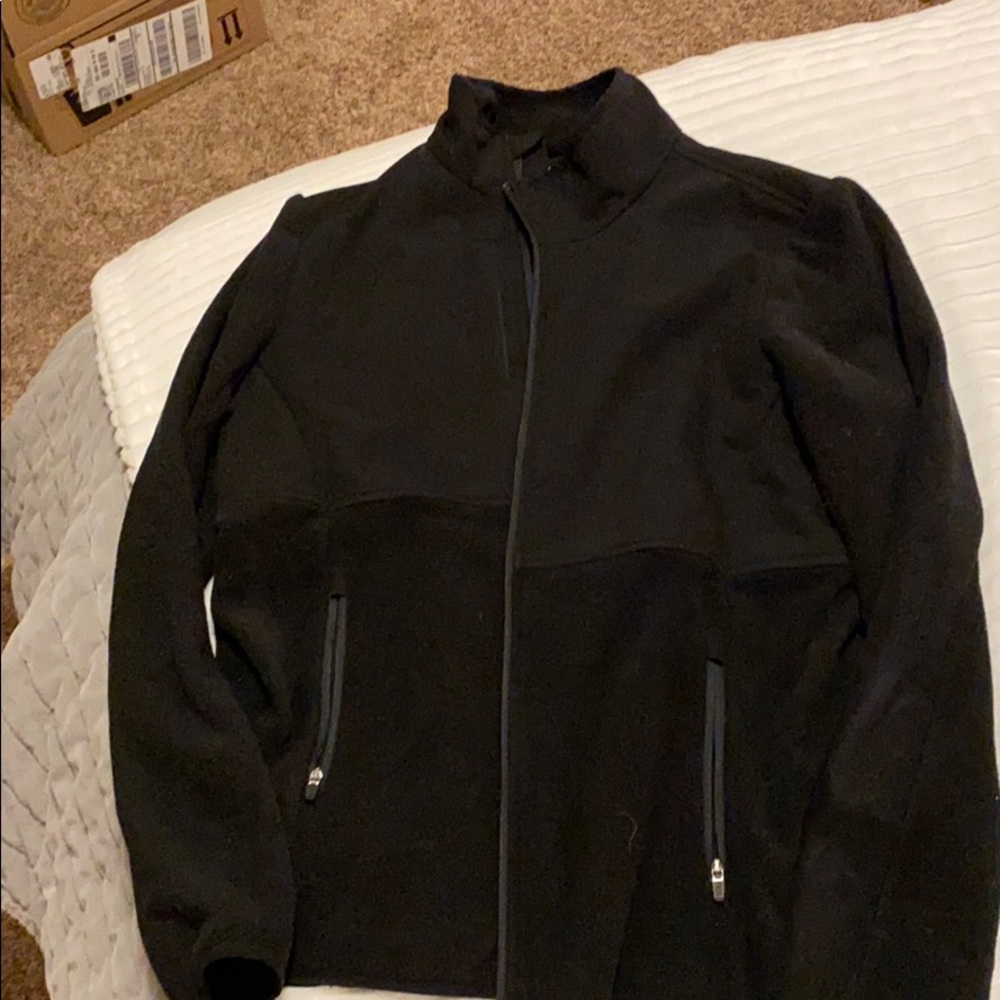 Figs fleece jacket with three pockets.